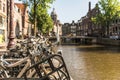 Bicycle handle bars in Amsterdam with the canal and houses in the background